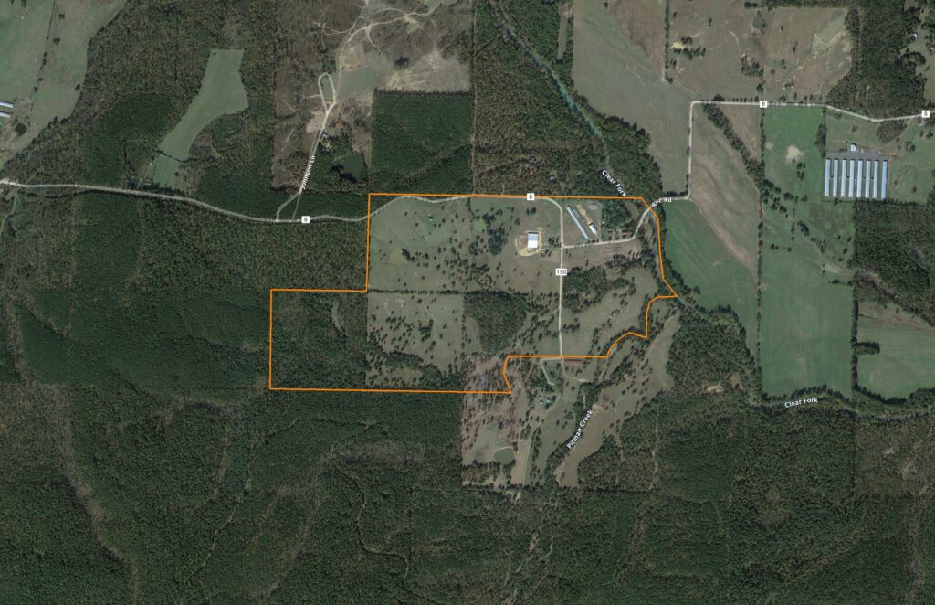 Premier Equestrian Ranch with River Frontage and National Forest Boundary: Aerial View