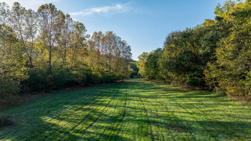 Turn-Key 160 Acres with Hurricane Creek, Timbered Ridges, and Pastureland