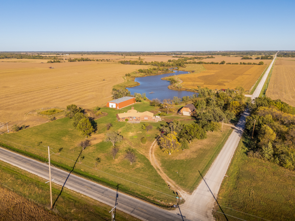 Coffey 61 - Oil Income, 8 Acre Pond, Big Shop & Home with Unlimited Potential