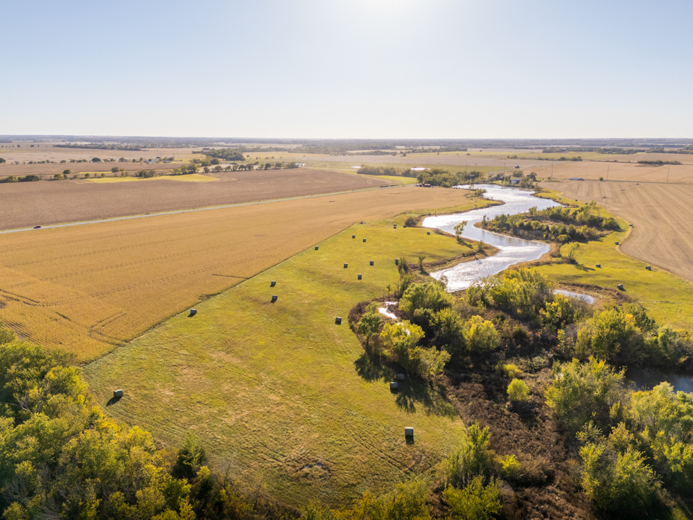 Coffey 61 - Oil Income, 8 Acre Pond, Big Shop & Home with Unlimited Potential