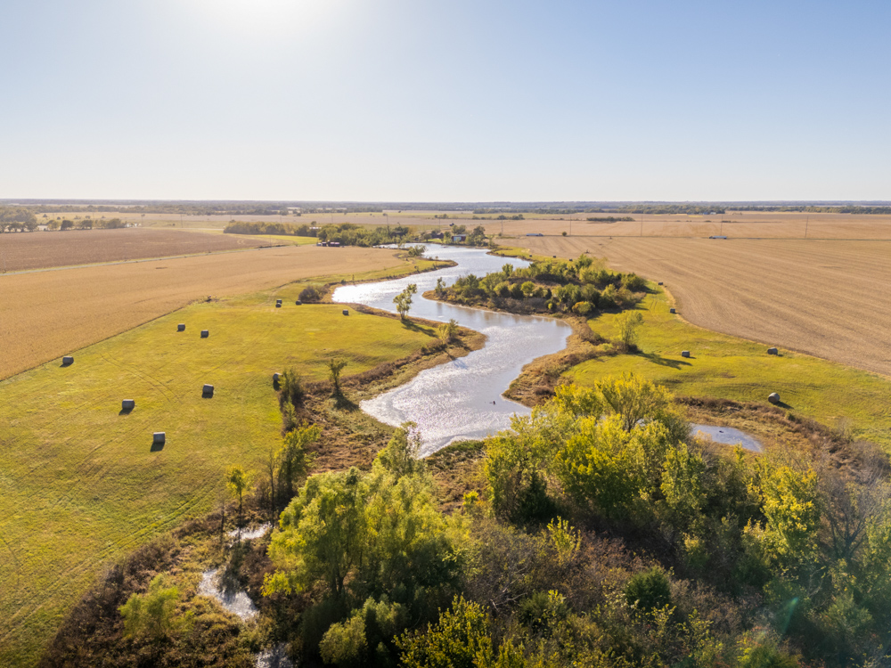Coffey 61 - Oil Income, 8 Acre Pond, Big Shop & Home with Unlimited Potential