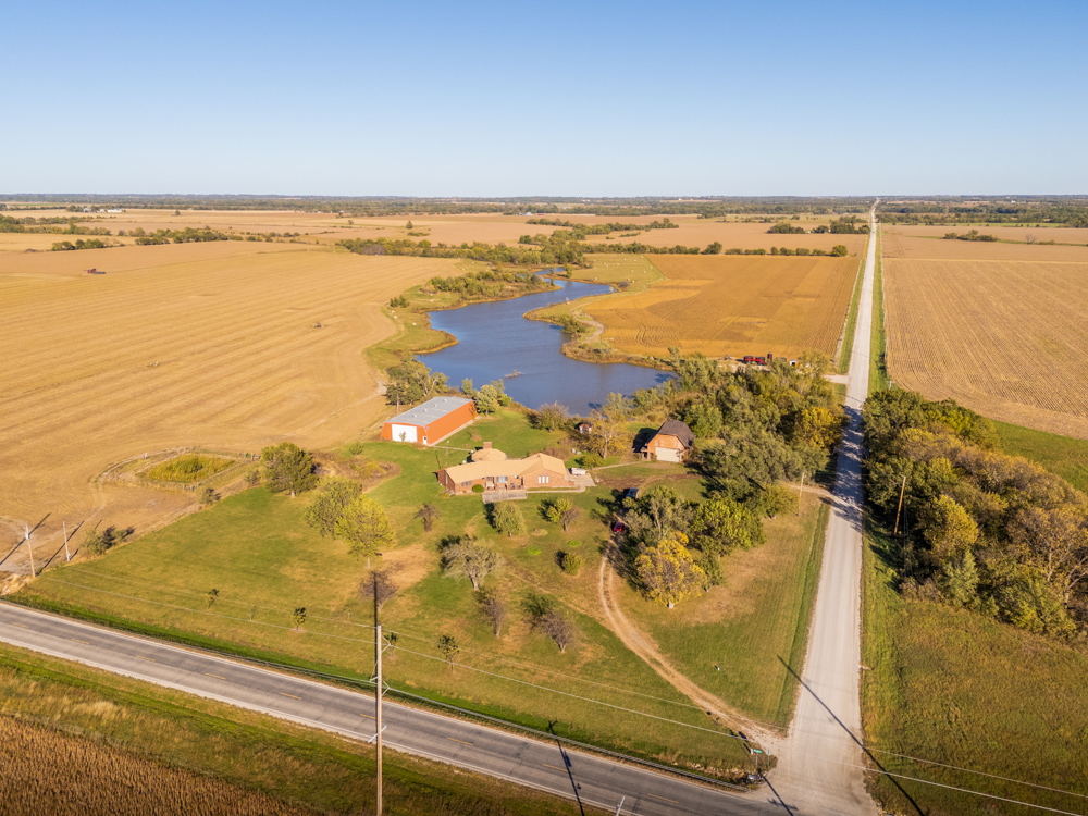 Coffey 61 - Oil Income, 8 Acre Pond, Big Shop & Home with Unlimited Potential