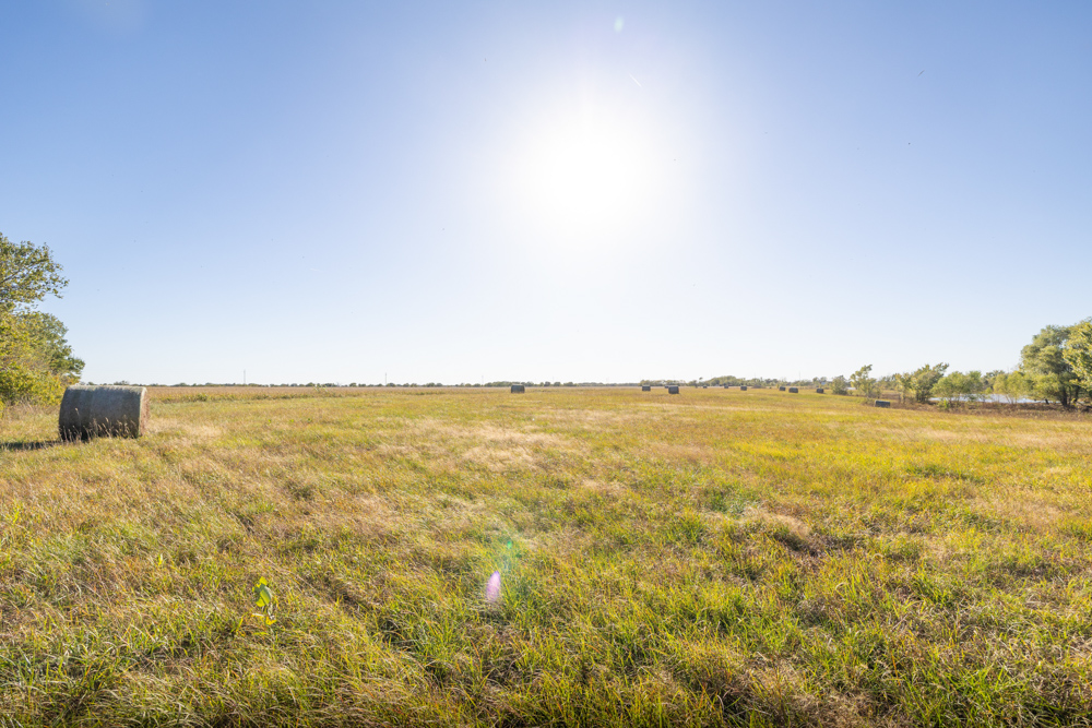 Coffey 61 - Oil Income, 8 Acre Pond, Big Shop & Home with Unlimited Potential