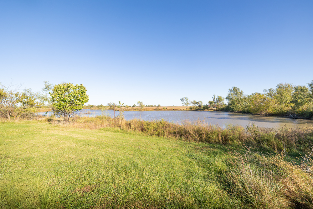 Coffey 61 - Oil Income, 8 Acre Pond, Big Shop & Home with Unlimited Potential