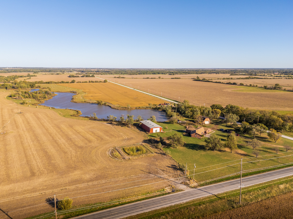 Coffey 61 - Oil Income, 8 Acre Pond, Big Shop & Home with Unlimited Potential