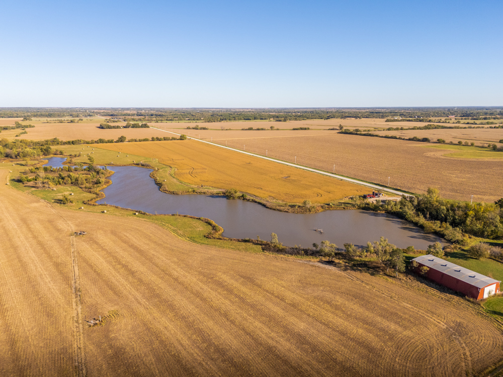 Coffey 61 - Oil Income, 8 Acre Pond, Big Shop & Home with Unlimited Potential