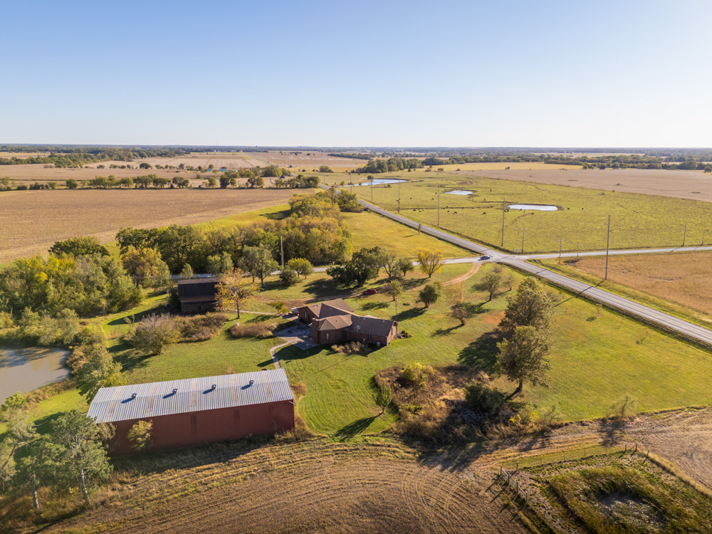 Coffey 61 - Oil Income, 8 Acre Pond, Big Shop & Home with Unlimited Potential