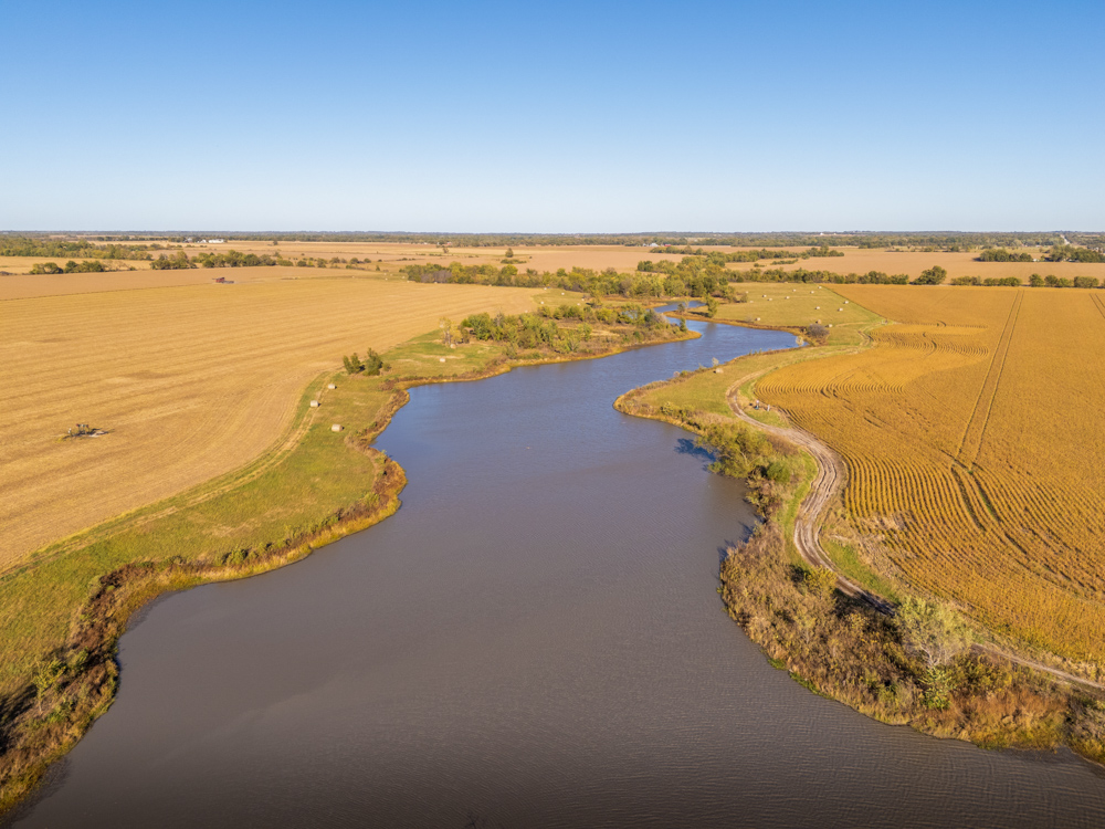 Coffey 61 - Oil Income, 8 Acre Pond, Big Shop & Home with Unlimited Potential
