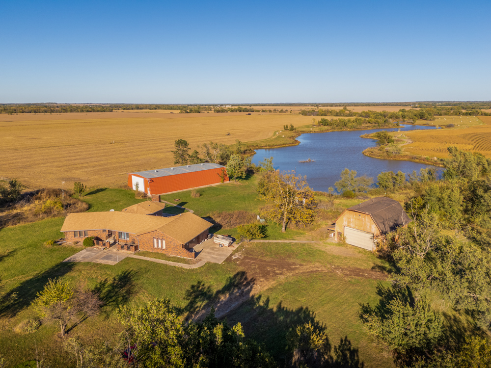 Coffey 61 - Oil Income, 8 Acre Pond, Big Shop & Home with Unlimited Potential