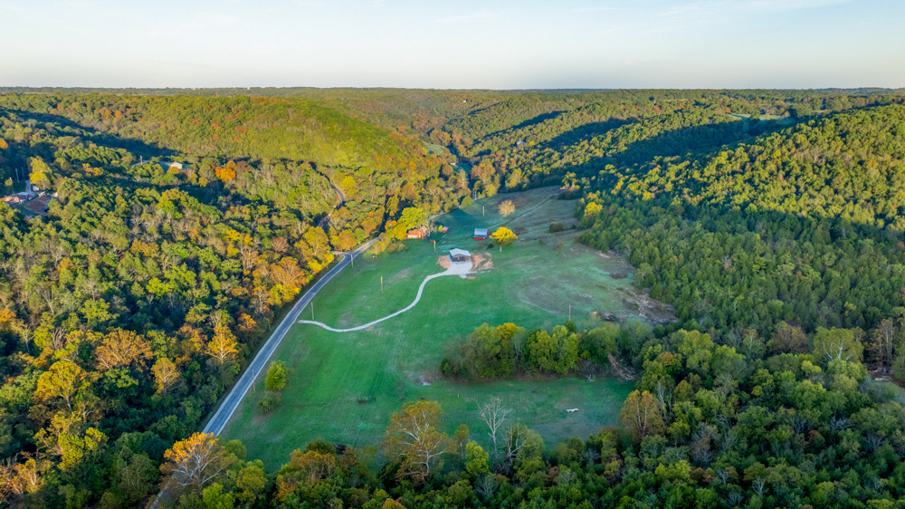 Turn-Key 160 Acres with Hurricane Creek, Timbered Ridges, and Pastureland