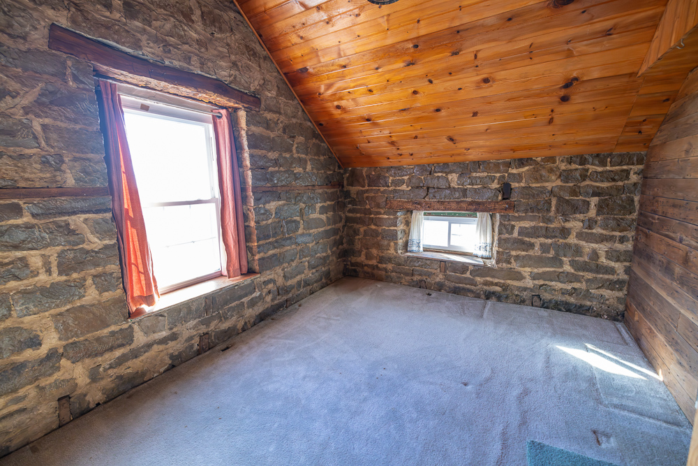 Stunning Hunting Acreage with Rustic Limestone Home