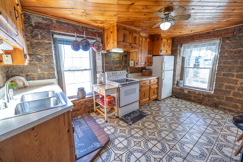 Stunning Hunting Acreage with Rustic Limestone Home