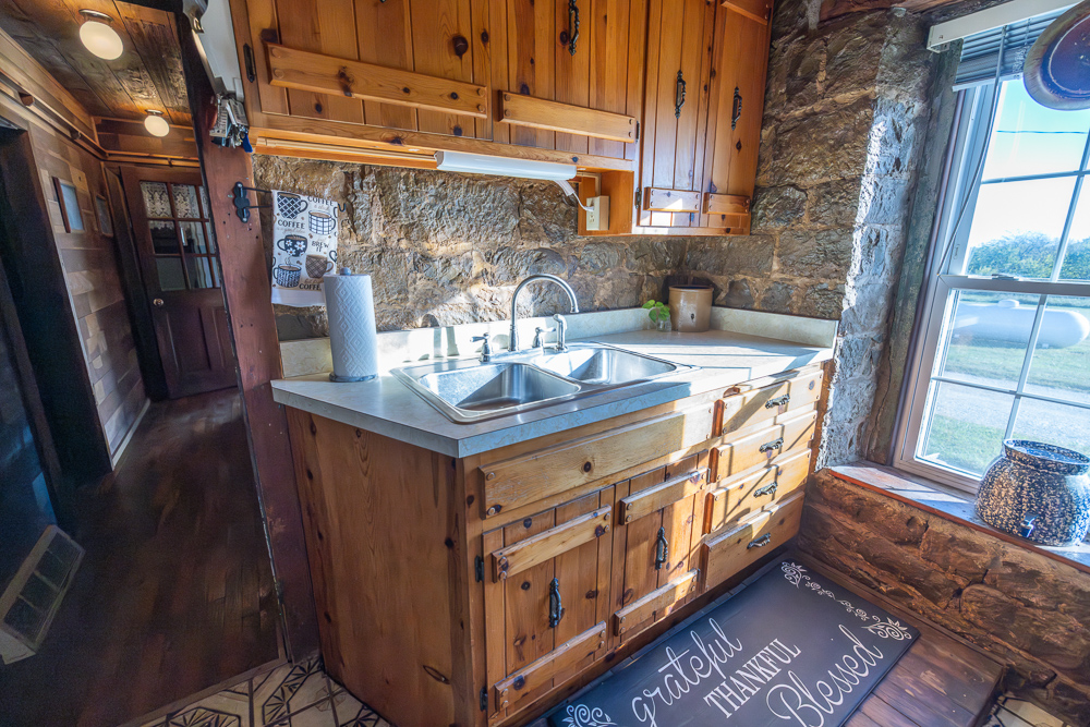 Stunning Hunting Acreage with Rustic Limestone Home