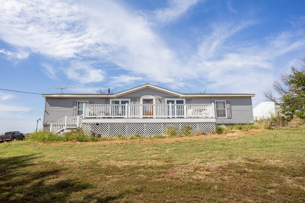 Sprawling Century Farm and Ranch with Pastures, Ponds, Hay Fields, Barns and a Home