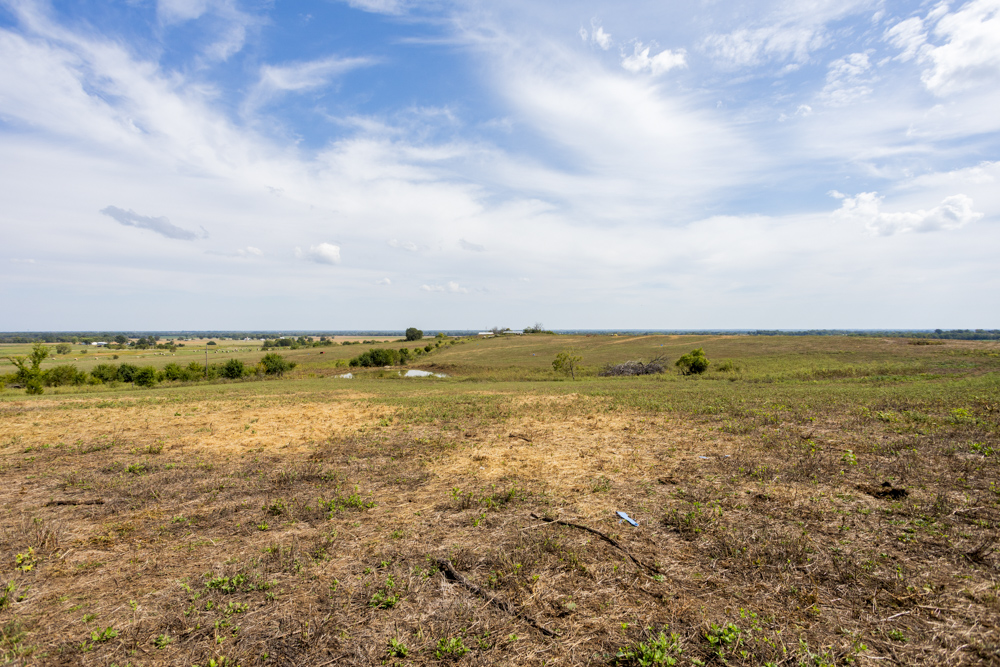 Sprawling Century Farm and Ranch with Pastures, Ponds, Hay Fields, Barns and a Home