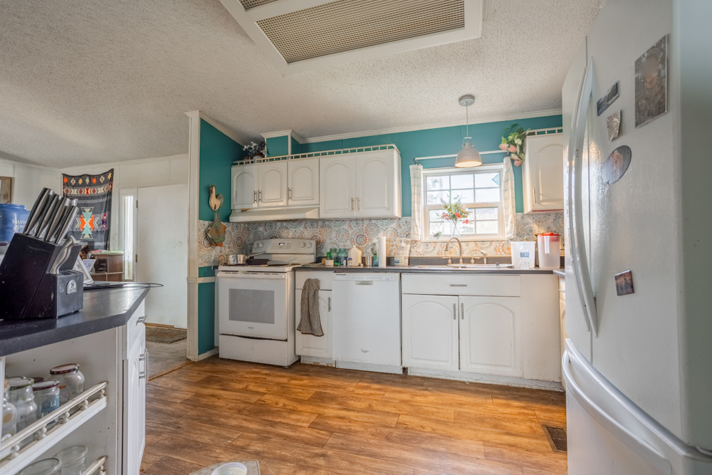 Sprawling Century Farm and Ranch with Pastures, Ponds, Hay Fields, Barns and a Home