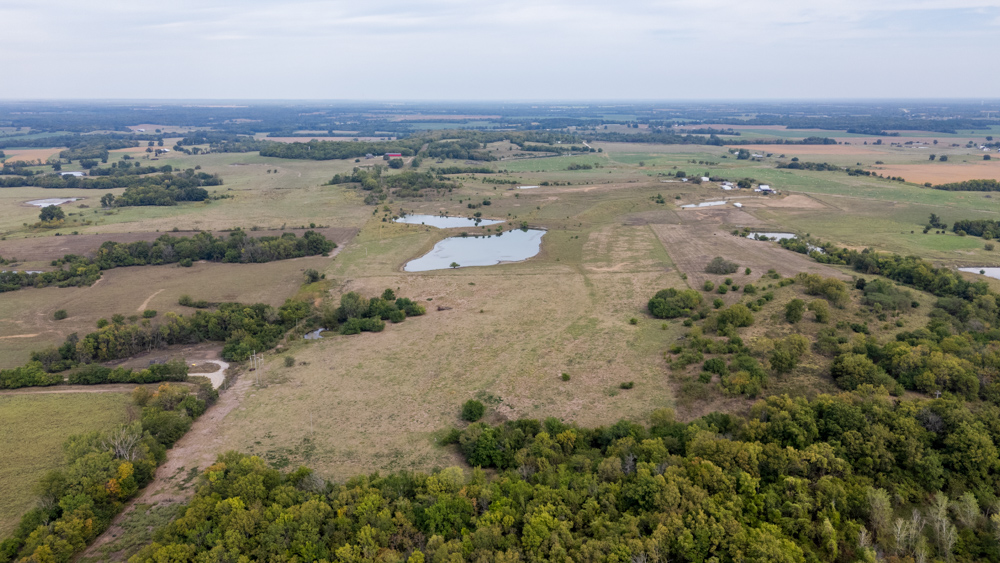 Sprawling Century Farm and Ranch with Pastures, Ponds, Hay Fields, Barns and a Home