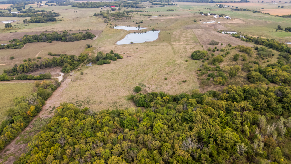 Sprawling Century Farm and Ranch with Pastures, Ponds, Hay Fields, Barns and a Home