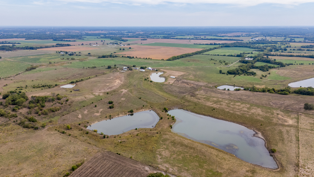 Sprawling Century Farm and Ranch with Pastures, Ponds, Hay Fields, Barns and a Home