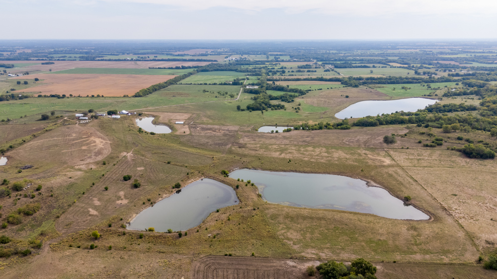 Sprawling Century Farm and Ranch with Pastures, Ponds, Hay Fields, Barns and a Home
