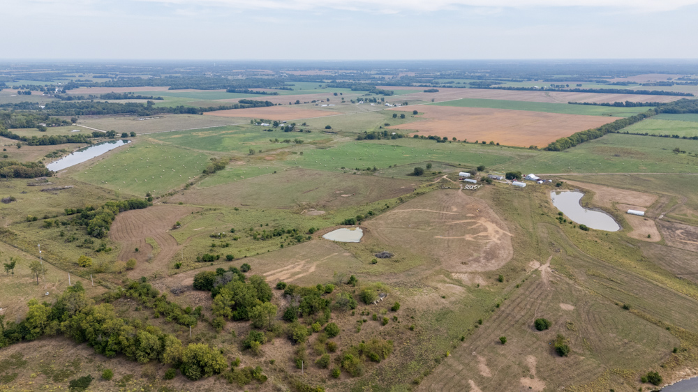 Sprawling Century Farm and Ranch with Pastures, Ponds, Hay Fields, Barns and a Home