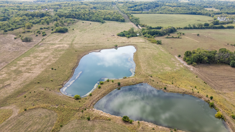 Sprawling Century Farm and Ranch with Pastures, Ponds, Hay Fields, Barns and a Home