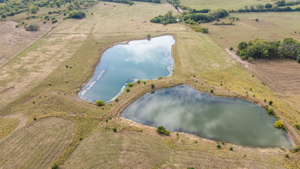 Sprawling Century Farm and Ranch with Pastures, Ponds, Hay Fields, Barns and a Home