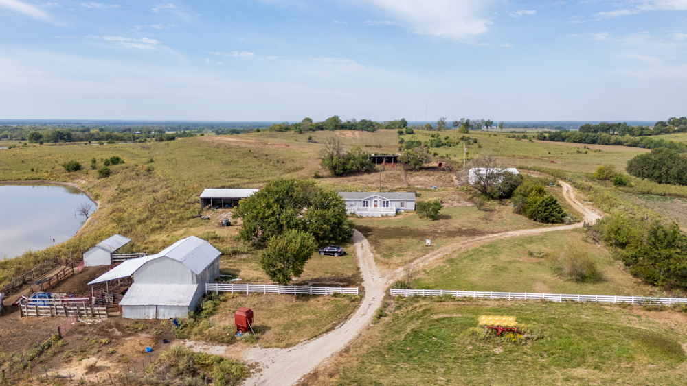 Sprawling Century Farm and Ranch with Pastures, Ponds, Hay Fields, Barns and a Home