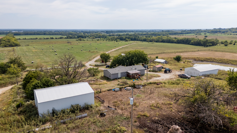 Sprawling Century Farm and Ranch with Pastures, Ponds, Hay Fields, Barns and a Home