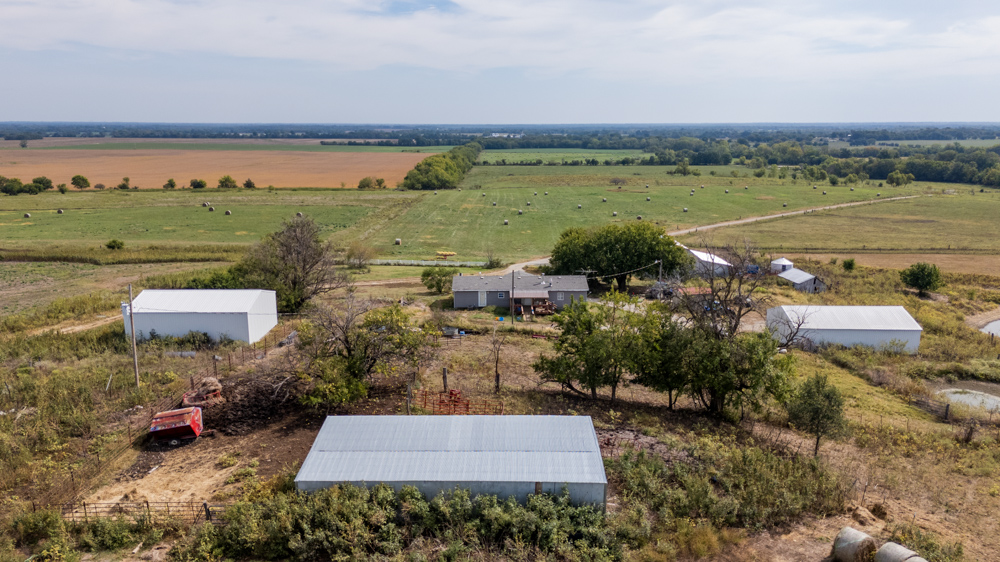 Sprawling Century Farm and Ranch with Pastures, Ponds, Hay Fields, Barns and a Home