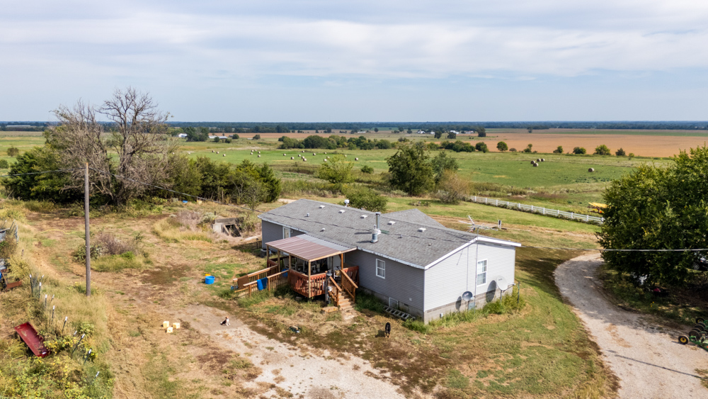 Sprawling Century Farm and Ranch with Pastures, Ponds, Hay Fields, Barns and a Home