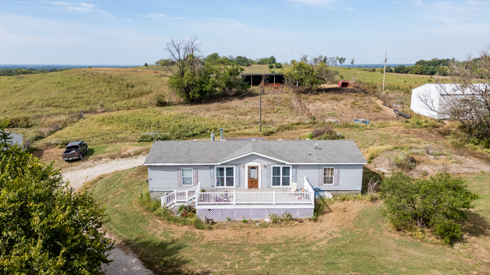 Sprawling Century Farm and Ranch with Pastures, Ponds, Hay Fields, Barns and a Home
