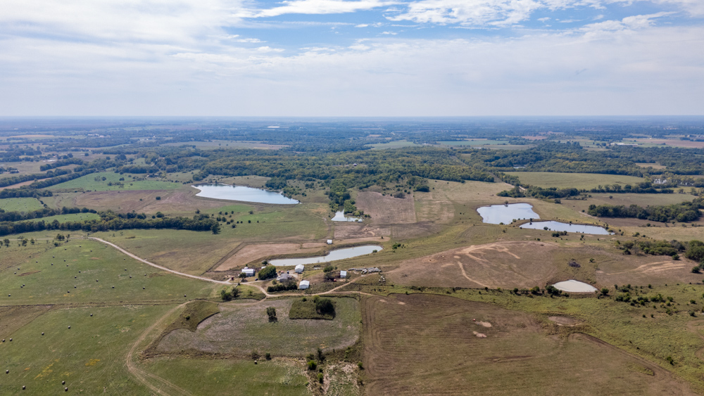 Sprawling Century Farm and Ranch with Pastures, Ponds, Hay Fields, Barns and a Home