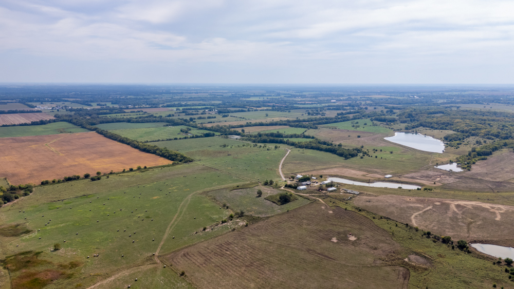 Sprawling Century Farm and Ranch with Pastures, Ponds, Hay Fields, Barns and a Home