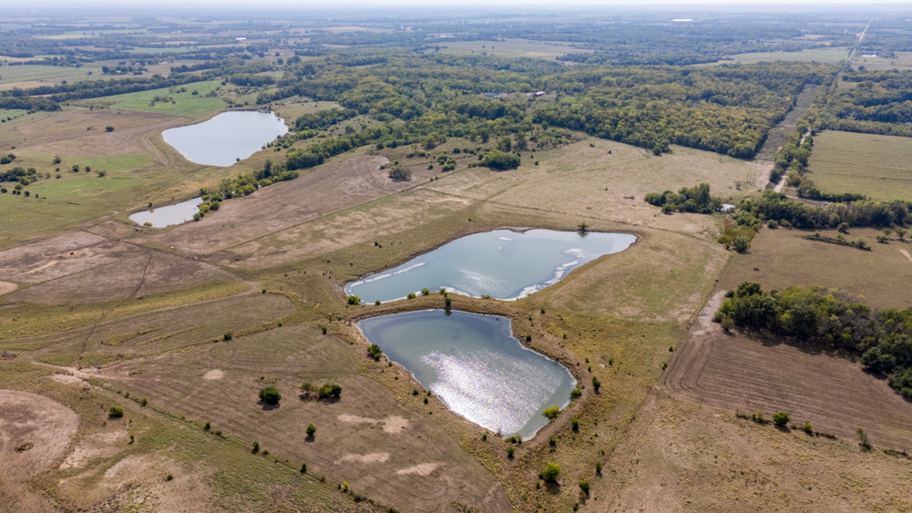 Sprawling Century Farm and Ranch with Pastures, Ponds, Hay Fields, Barns and a Home